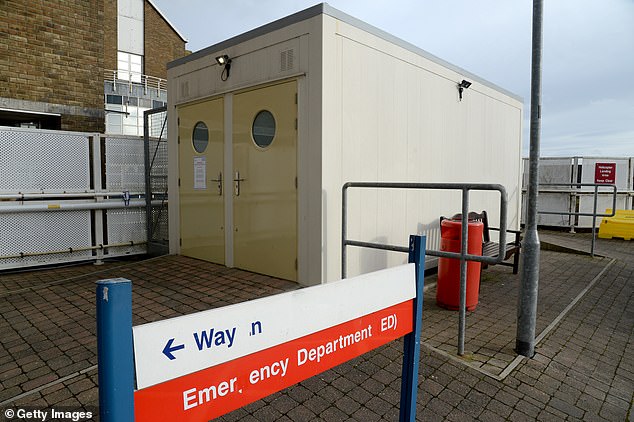 The coronavirus ‘isolation pods’ in Britain’s hospitals: NHS sets up windowless shipping containers and rusty cabins as a NINTH case is diagnosed in the UK